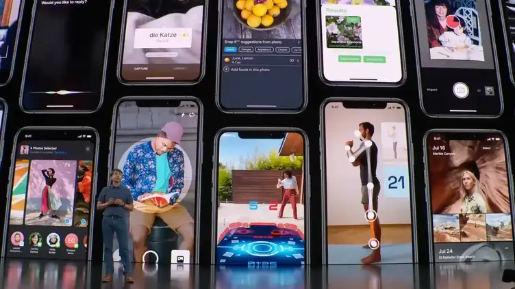 Apple’s 2019 keynote stage, a wall of iPhone screens running apps built on the A13 Bionic’s machine learning accelerators
